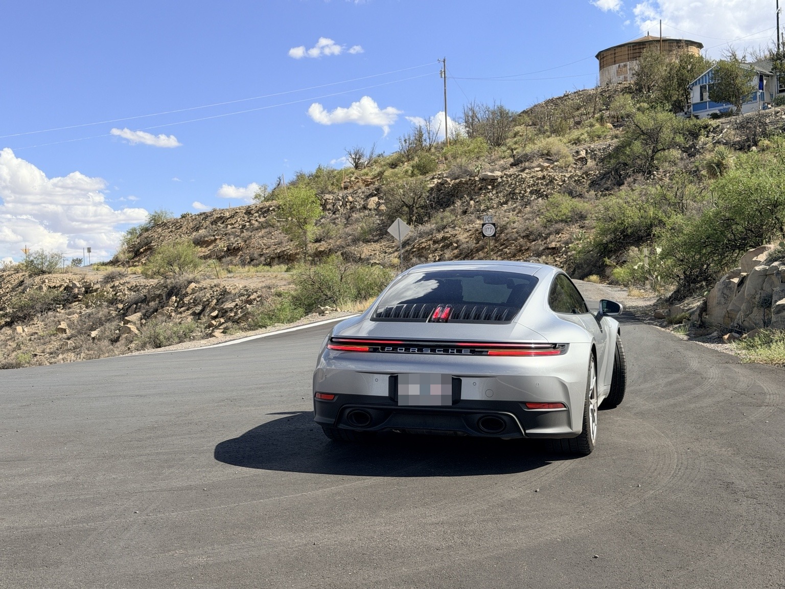 David’s GT Silver 911 Carrera S, Silver Ghost, seen from behind on a mountain road
